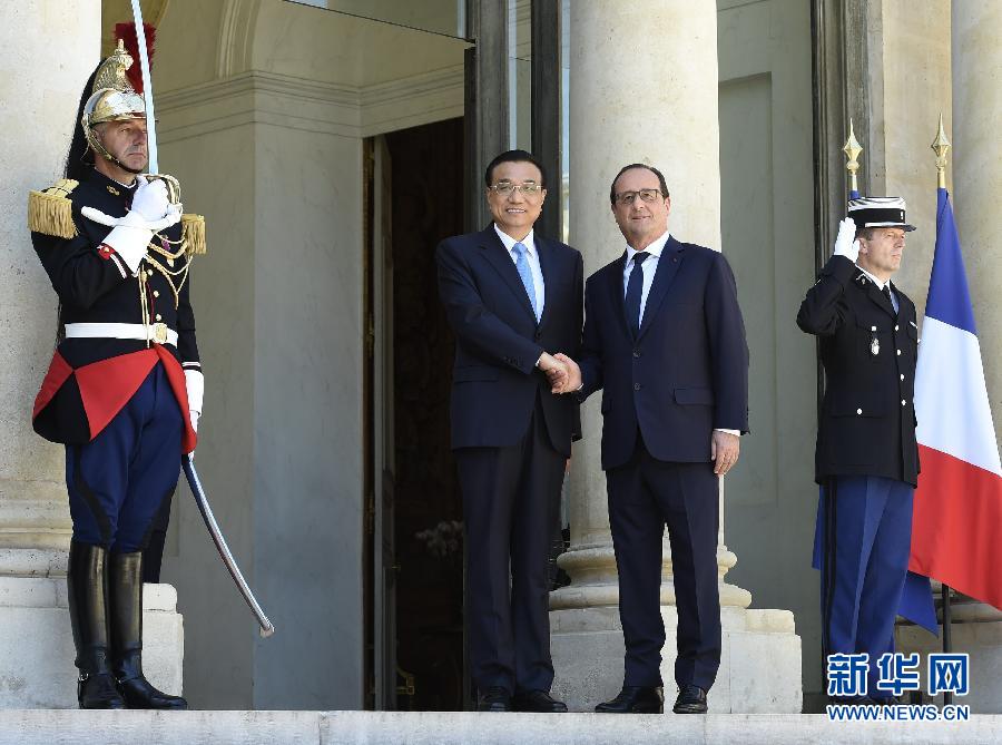 當?shù)貢r間6月30日下午，國務院總理李克強在巴黎愛麗舍宮會見法國總統(tǒng)奧朗德。 新華社記者李學仁攝